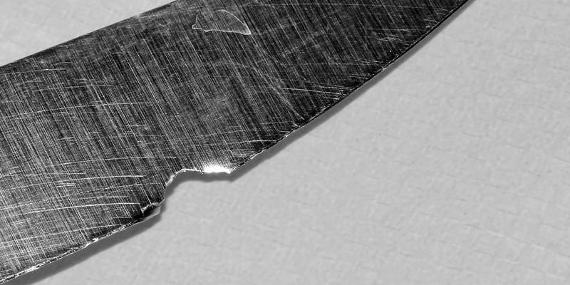 Example of a chipped knife edge: a small notch broken out of the cutting edge of a kitchen knife blade